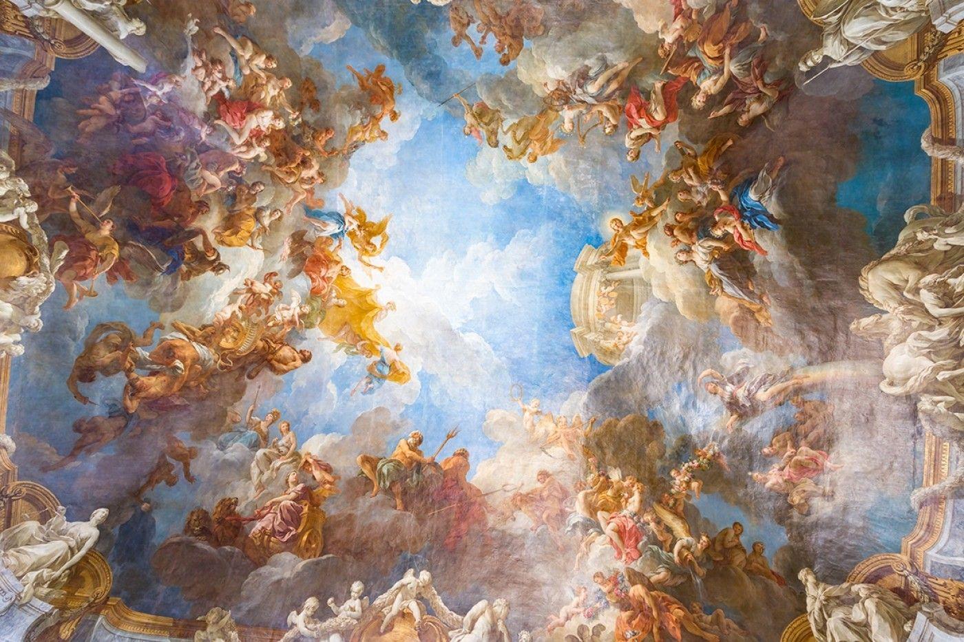 Magnificent baroque ceiling fresco with heavenly figures and golden light